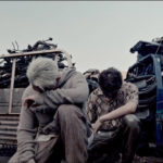 XRO（ゼロ）、「Chuckle（JP version）」のMV versionBを公開！ 退廃的な雰囲気漂う廃車場を舞台にクールなラップが鳴り響く